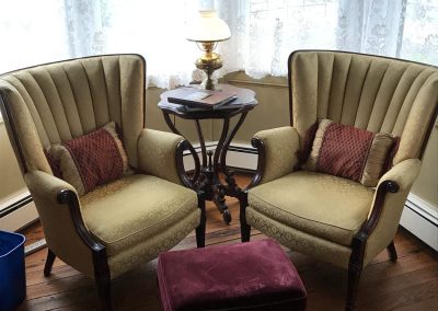 Queen Victoria Room Sitting Area with Beautiful Tufted Gold Chairs with Wood Trim