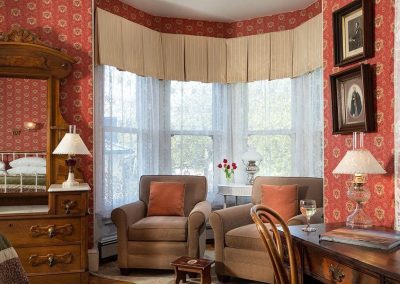 Prince Albert room bay window sitting area with two comfy upholstered chairs