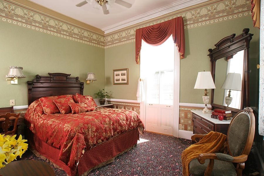 Prince Alfred Guestroom Queen Bed with antique mahogony headboard