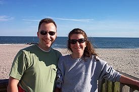 Guest Photos- Smiling couple next to ocean.