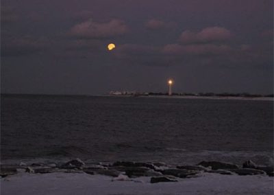 Cape May Nature- Nightime picture of lighthouse and moon.