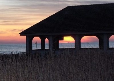 Cape May Nature- Sunset picture of building and beach.
