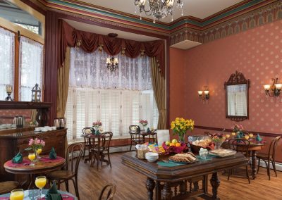 House of Royals Dining Room set for a Breakfast Buffet with private bistro table seating