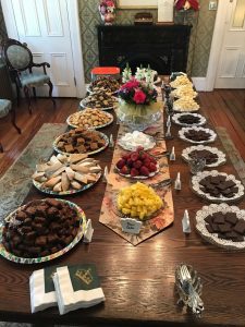 Dining Table with Vast Array of Chocolate Baked Treats, Fruit and Artisan Chocolates