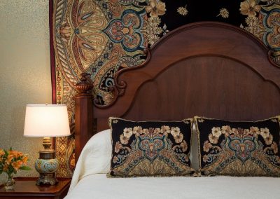 Lord Melbourne Guestroom Headboard with Custom Tapestry and Matching Throw Pillows.